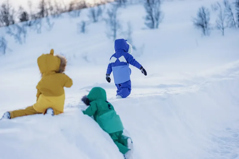 Children in Roarsome snowsuits
