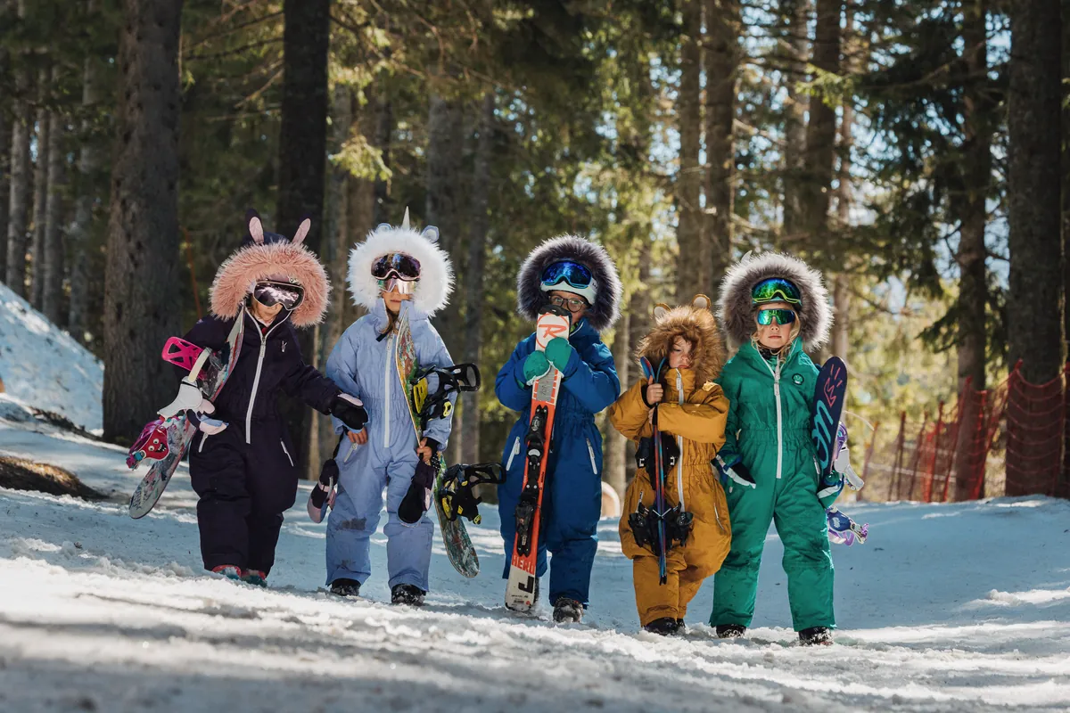 Children in Roarsome animal snowsuits